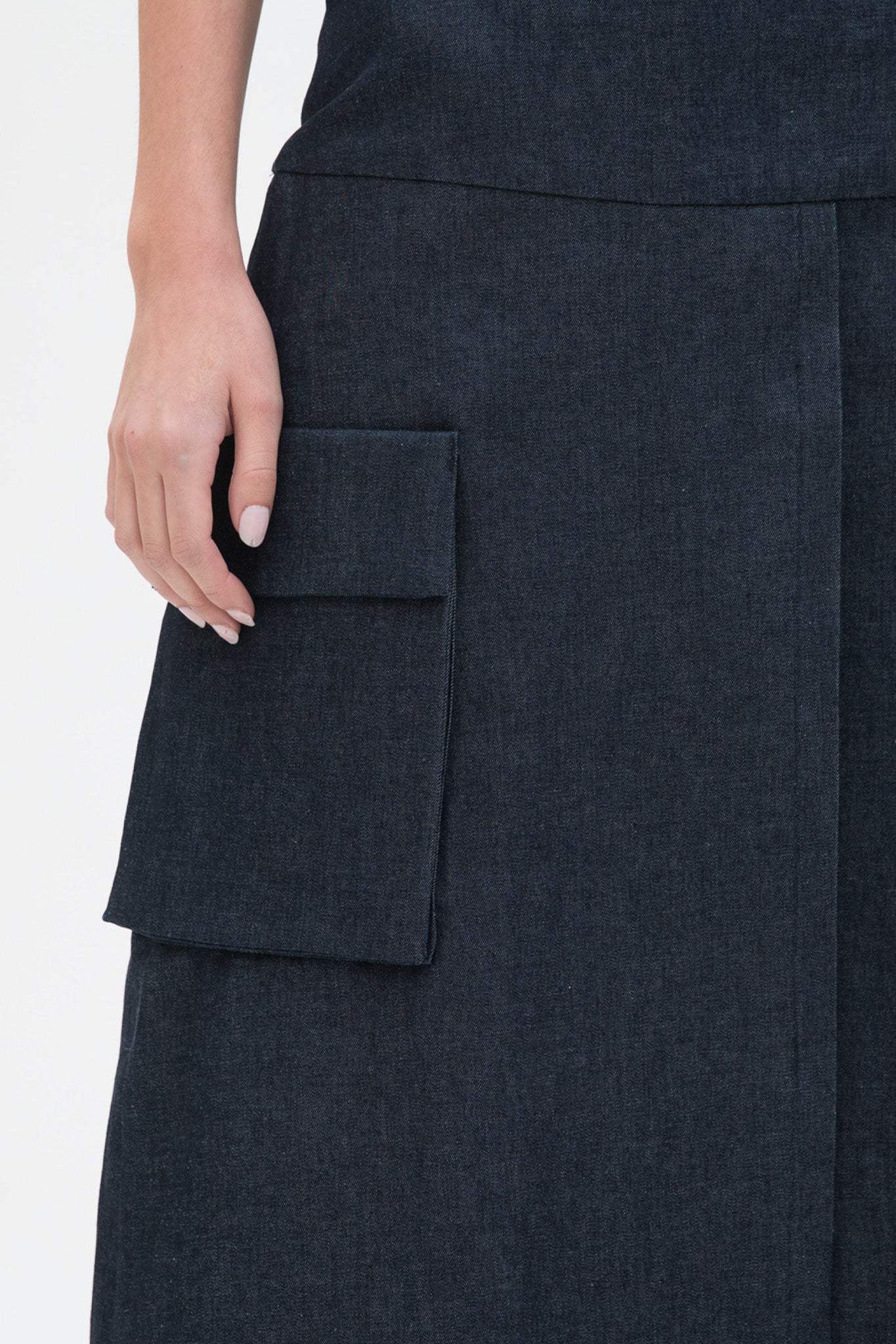 A knee length navy skirt with large pockets.