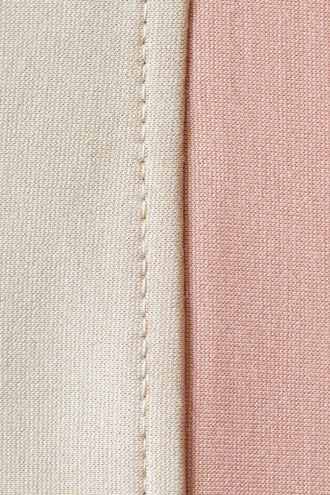 A close up of pink and nude fabric