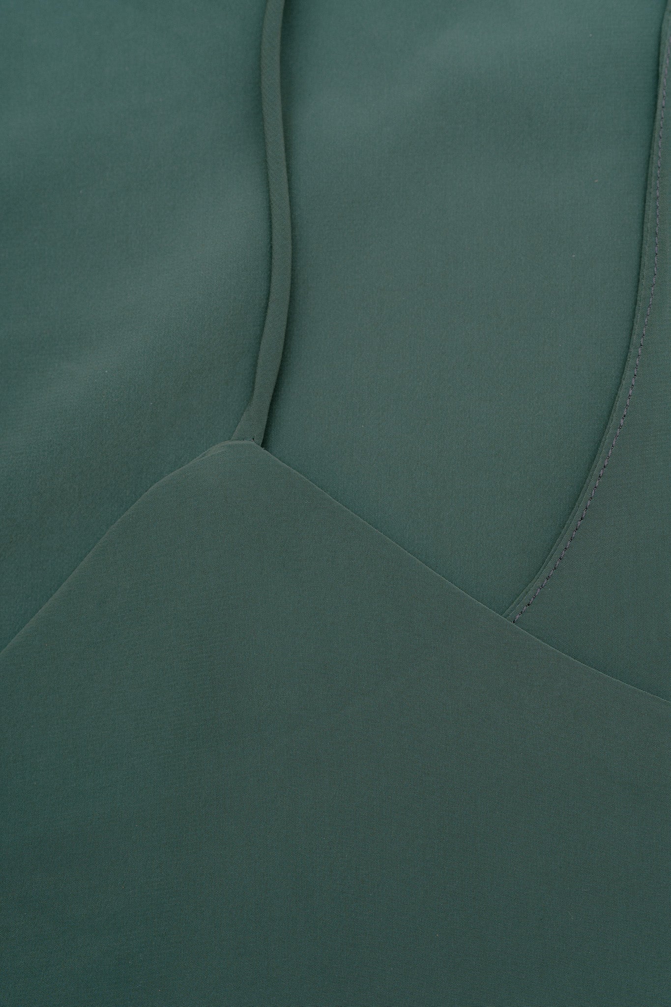 A close up of a green silky dress